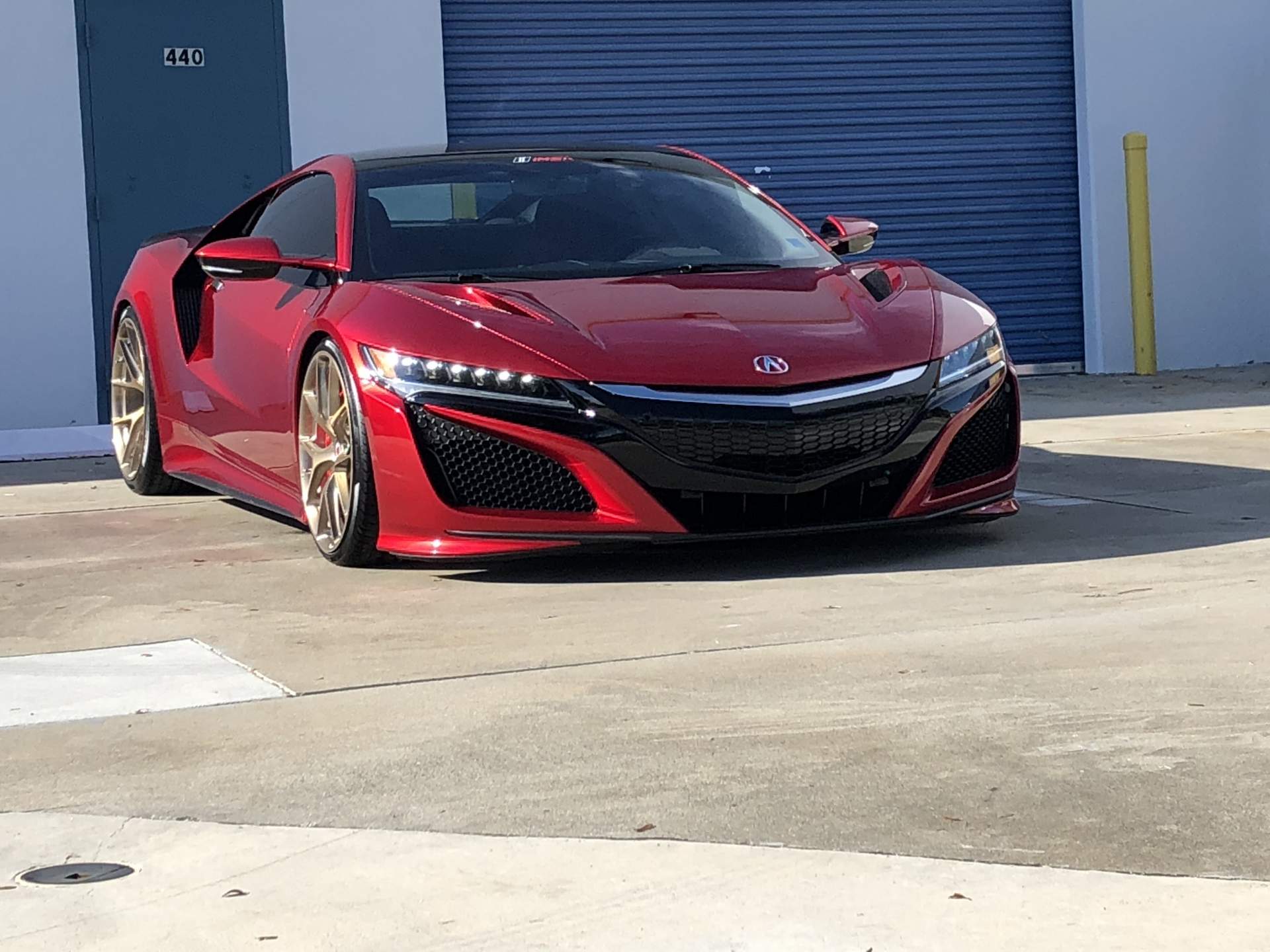 Red Honda NSX shined up shown diagonally 